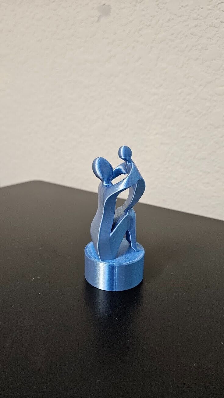 Mother and child statue - shimmering silver and blue color changing with light