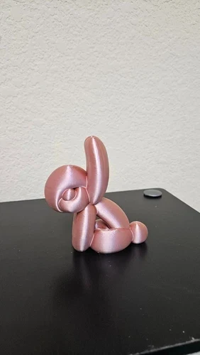 Rose-gold 3D-printed balloon-animal sculpture