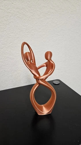 Man and woman dancing statue