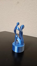 Mother and child statue - shimmering silver and blue color changing with light